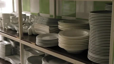 There are many different white plates in the restaurant kitchen. Stock Footage 138674786