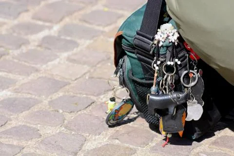 There are many keychains hanging on the backpack. Stock Photos