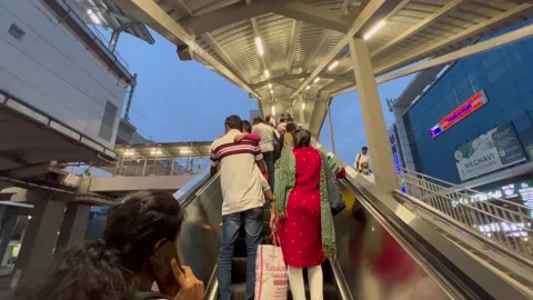 There are many people using the escalator, which makes it easier for them Stock Footage 207747440