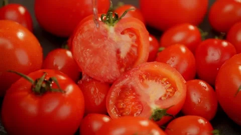 There are many tomatoes on the table, on which water is poured. Stock Footage 267032835