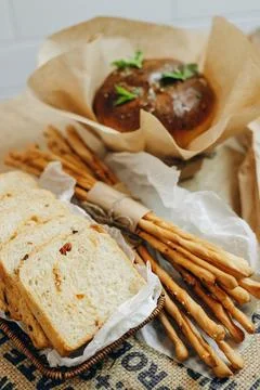 There are one bread donuts, a few bread toasts and a lot of sticks. Stock Photos