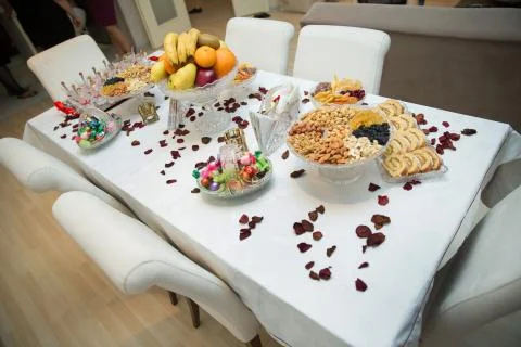 There are petals, walnut kernels, hazelnut kernels, raisins, almonds, fruits  Stock Photos