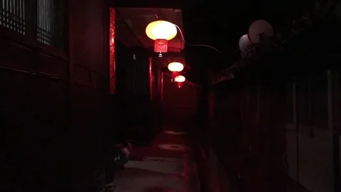 There are red lanterns hanging on the eaves of the windows Stock Footage 235133732
