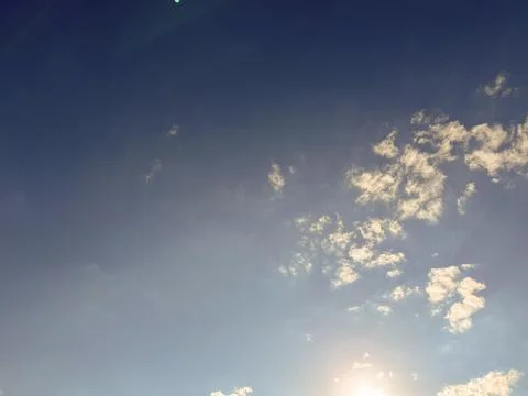 There are soft fluffy clouds in the sky Stock Photos