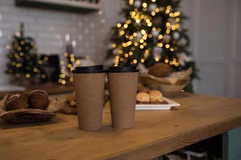 There are two cups on the countertop. Christmas bokeh. Christmas mood. The Stock Photos