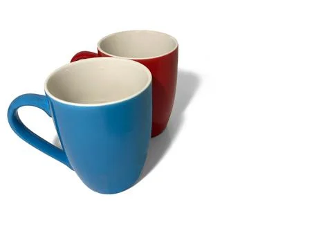 There are two cups on a white background. Stock Photos