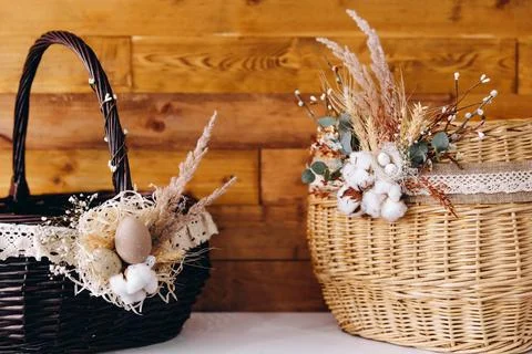 There are two Eastern baskets on the wonderful wood brown background. Stock Photos