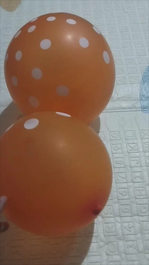 There are two orange balloons Stock Footage 294733731