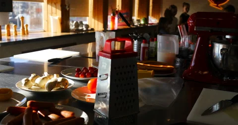 There are vegetables on the big kitchen table in plates Stock Footage 139529823
