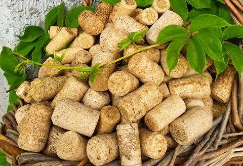 There are wine corks in an old wicker basket Stock Photos