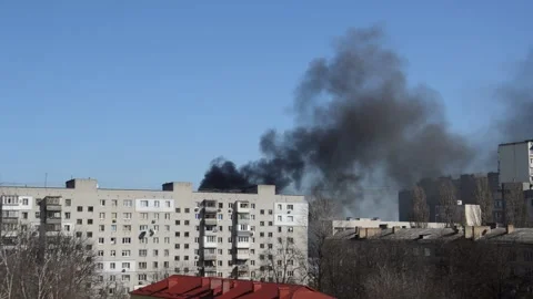 There is black smoke from a rocket or bomb explosion in a city during a war Stock Footage 172203246