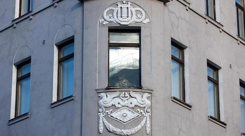 There is a building that features a crown located at its corner Stock Photos