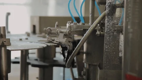 There is a conveyor for bottling drinking water. Details of the conveyor. Stock Footage 105978897