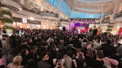 There is a crowd of young fans in front of the stage. Video stock 329140662