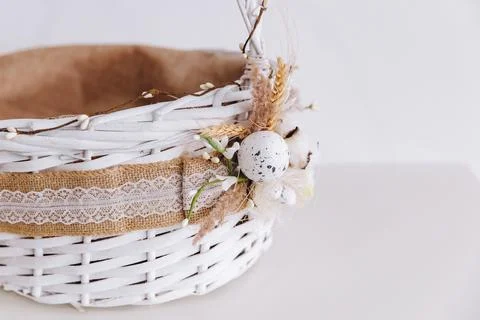 There is a decorative white Eastern basket on the white background. Stock Photos