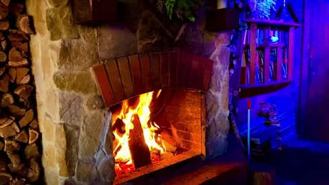 There is a fire burning in the fireplace. Cozy atmosphere. Stock Footage 260175956