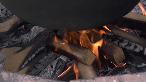 There is a fire burning under a cauldron. Stock Footage 285955741