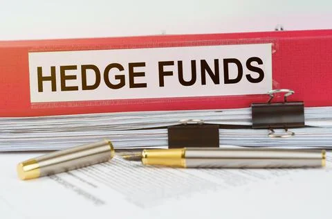 There is a folder on the documents with the inscription - HEDGE FUNDS Stock Photos
