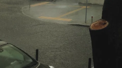There is Heavy and Persistent Rainfall Occurring on Urban Streets, Creating Stock Footage 317394552
