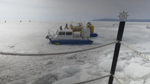 There is a hovercraft on the ice of Lake Baikal Stock Footage 264659729