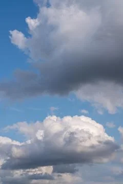 There is a large, cumulus cloud in the blue sky. Close-up Stock Photos
