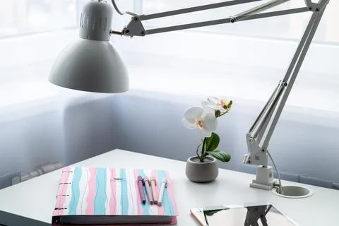 There is a large notebook on the table. Stock Photos