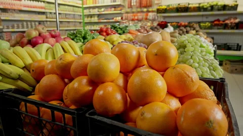 There is a large selection of different fruits on the counter in the supermarket Stock Footage 246708182