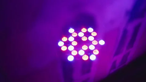 There is a multicolored lamp on the stage and it shines with lights Stock Footage 197291484