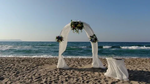 There is a nice white tent close to the beach. It is ready for the new couples 스톡 동영상 120874137