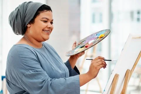 There is no right or wrong to art. an attractive young artist standing alone and Stock Photos