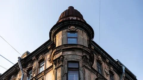 There is an old building featuring a distinctive dome on top of it Stock Photos