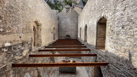 There is an old castle at the foot of the mountain. Stock Footage 165619135