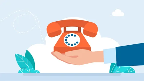 There is an old red telephone with a receiver on a hand. Hand holding telephone Video stock 306404846