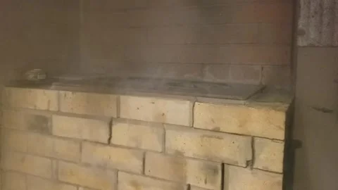 There is an old stove in the house full of smoke. Stock Footage 253256139