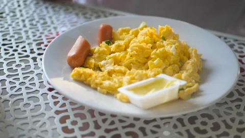 There is an omelet with a sausage fork, close-up. HD, 1920x1080, slow motion Stock Footage 132905815