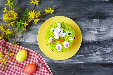 There is a plate with an Easter cake on the table Stock Photos