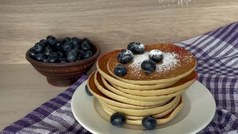 There is a plate with pancakes on the table Stock Footage 247233430
