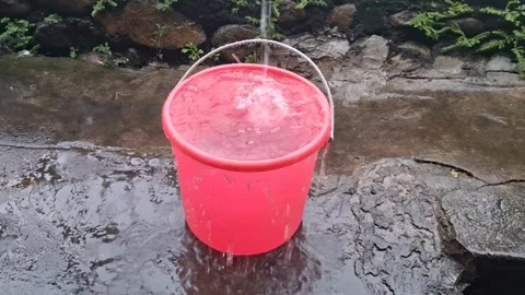 There is rainwater in the bucket (1) Stock Footage 308420976