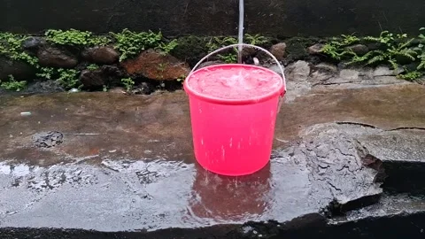 There is rainwater in the bucket (6) Stock Footage 308421897