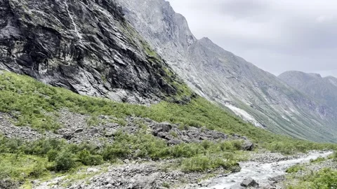 There is a river flowing in the mountains Stock Footage 317246276