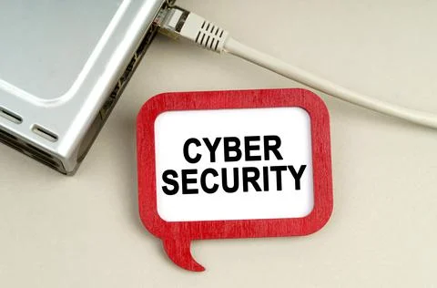 There is a router connected to the network on the table, next to a sign that  Stockfoto's