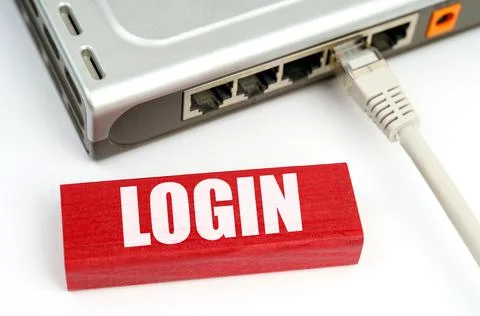 There is a router connected to the network on the table, next to a plaque wit Foto stock