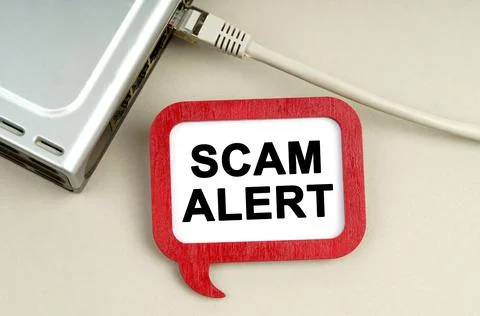 There is a router connected to the network on the table, next to a sign that  写真素材