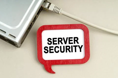 There is a router connected to the network on the table, next to a sign that  스톡 사진