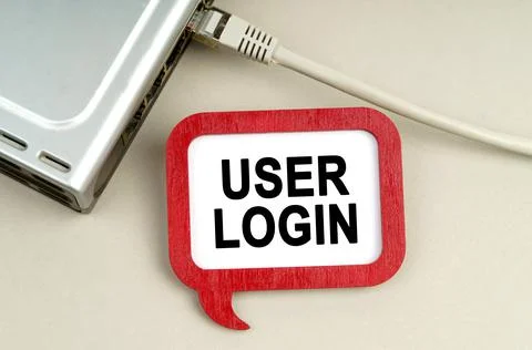 There is a router connected to the network on the table, next to a sign that  写真素材