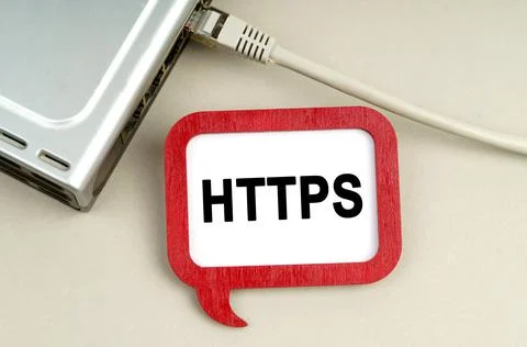 There is a router connected to the network on the table, next to a sign that  Stockfoto's