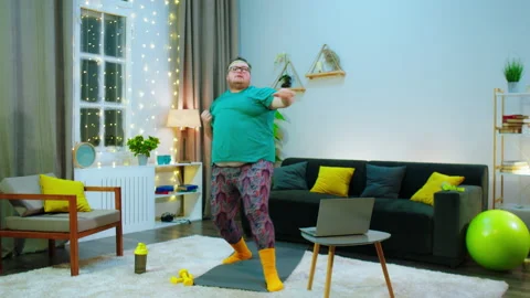 There s a big man doing karate and boxing the air, he s feeling very excited Stock Footage 159559764