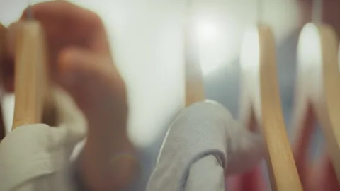 There is a sale going on in a bright store, a stylish woman in stylish cloth Stock Footage 265077925