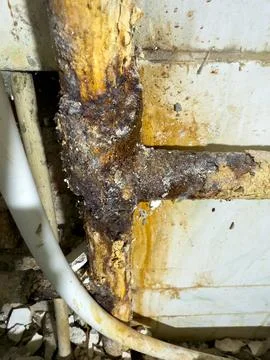 There is a serious problem with rusty joints of old metal water pipes. Stock Photos