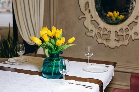 There is a set table for a romantic dinner. Stock Photos